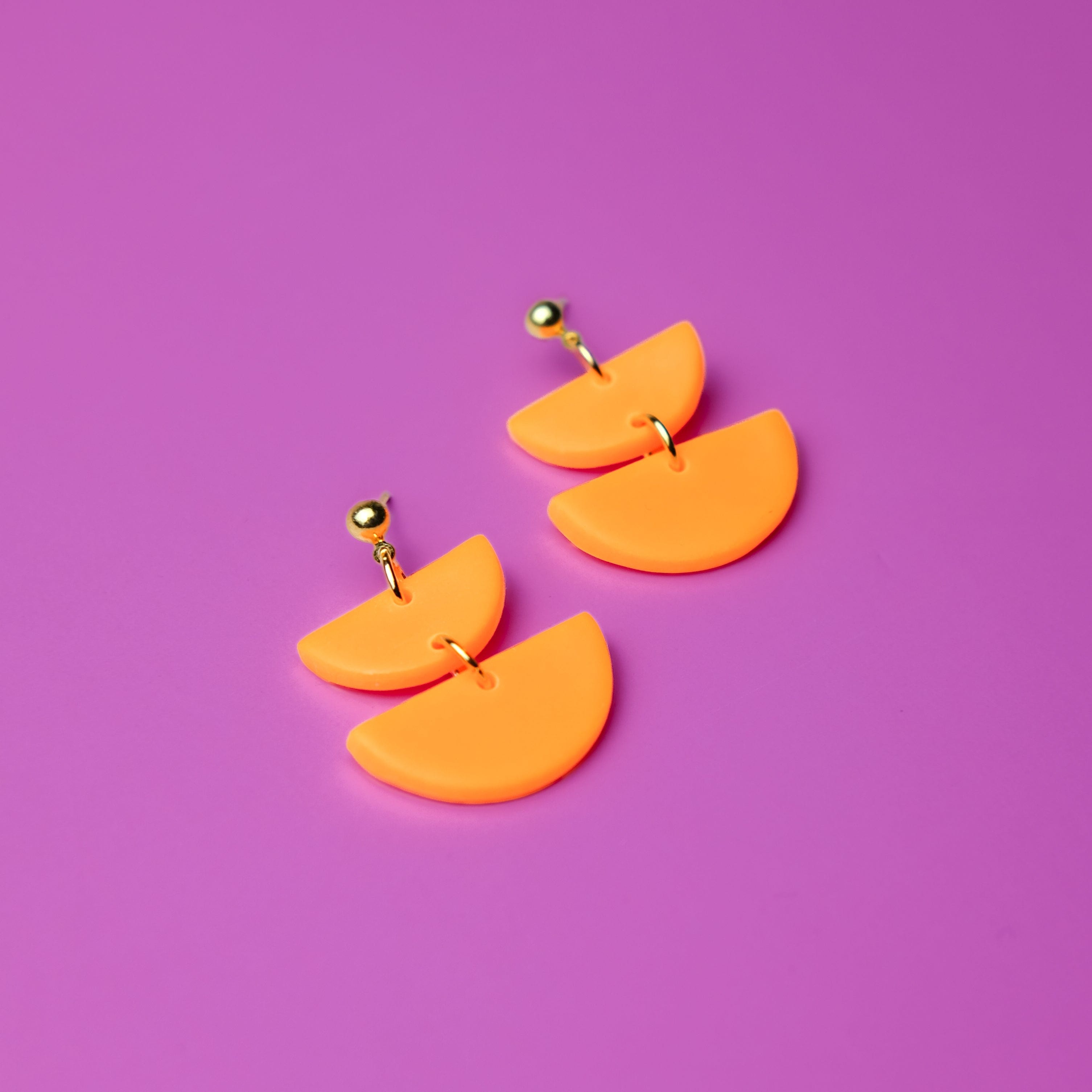 Twin Luna cute dangly half-moon shaped earringsin neon orange #color_neon-orange